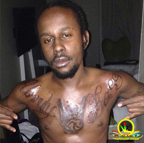 popcaan gets giant quot unruly boss quot tattoo across chest popcaan gets giant quot unruly boss quot tattoo across chest
