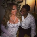 Nick Cannon checks out Mariah Carey's boobs for New Year's Day 2014