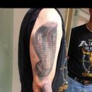 How awesome is this 3-D snake tattoo?