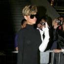 Rihanna - black dress and left arm white sleeve