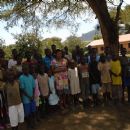 Rita with children who have one parent living and in school; Karamoja, Uganda