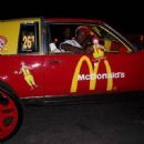 SMH @ a grown-ass man carrying around the McDonalds doll