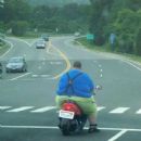 He's giving the shocks on that scooter THE BUSINESS!