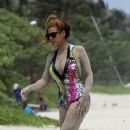 Beyonce on vacation, playing in the sand