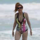 Beyonce on vacation, playing in the sand