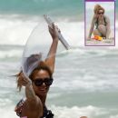 Beyonce on vacation, playing in the sand