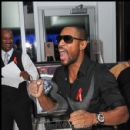 Singer Tank reacts after winning a silent auction item at Big Tigger's Wknd