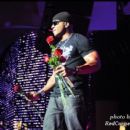LL Cool J prepares to throw roses to the ladies in the Superdome crowd