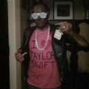 White guy dressed in black face as Kanye West