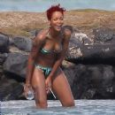 Have you seen Rihanna's new gun tattoo? Don't worry it's temporary