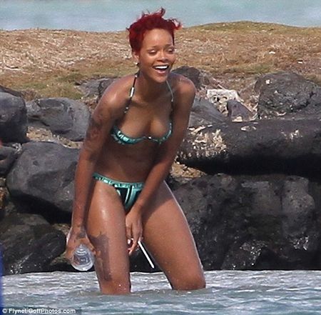 rihanna tattoos gun. Rihannaand the gun tat