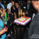 The cake arrives to the VIP section where Willis and Friends celebrate his Birthday