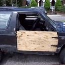 How do you attach a wooden door to your truck?