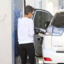 Yes, Halle Berry pumps her own gas
