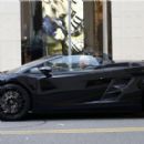 Amber Rose crusing through Beverly Hills in a black Lamborghini