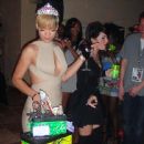 Rihanna examines the novelty birthday cake that was shaped like boxes of presents at her 22nd Birthday Party (2010)