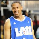 Nick Cannon smiles at fans at the NBA AllStar Celebrity Basketball Game