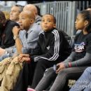 Music Executive Kevin Liles and his kids watch the NBA AllStar Celebrity Basketball Game