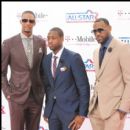 Chris Bosh, Dwyane Wade, and Lebron James pose for a picture on the magenta carpet