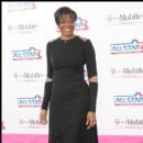 WNBA Star Sheryl Swoops smiles for the cameras on the carpet
