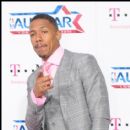 Actor Nick Cannon stops for a picture on the magenta carpet