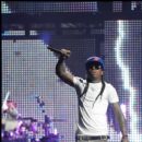 Lil Wayne signals to the crowd during his performance in Wash DC