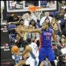 Wizards Mustafa Shakur drives against Pistons Greg Monroe