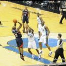 Hawks Damien Wilkins shoots the fade-a-way over Wizards Larry Owens