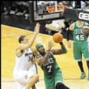 Celtics Jermaine O'Neal goes up for the layup on Wizards JaVale McGee