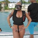 Amber Rose prepares to scuba dive