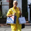 Amber Rose was spotted at the West Hollywood shopping in this canary jumpsuit & Timbs