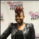 Singer Ledisi poses for a picture backstage at the Superdome