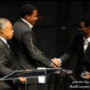 Comedian Chris Rock receives his awards and is congratulated by Actor Lamman Rucker and Rev Al Sharpton 