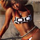 Kelis keeps it sexy in a bathing suit