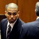 Chris Brown suited and booted...for the wrong reasons