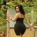 Light-skin redbone in all black with serious booty