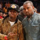 Lil Wayne and Kanye West attend the L.A. Lakers vs Chicago Bulls game on Christmas