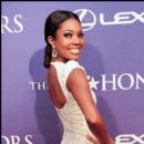 2012 BET Honors host Gabrielle Union is all smiles on the red carpet