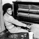 A young Michael Jackson at the piano