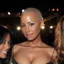 Amber Rose is about to spill out of her dress!