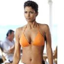 Halle Berry looks stunning in an orange bikini