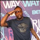 Wale salutes the media on the red carpet for BET Rip the Runway