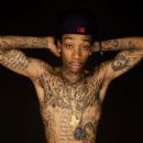 Wiz showing off his tattoos