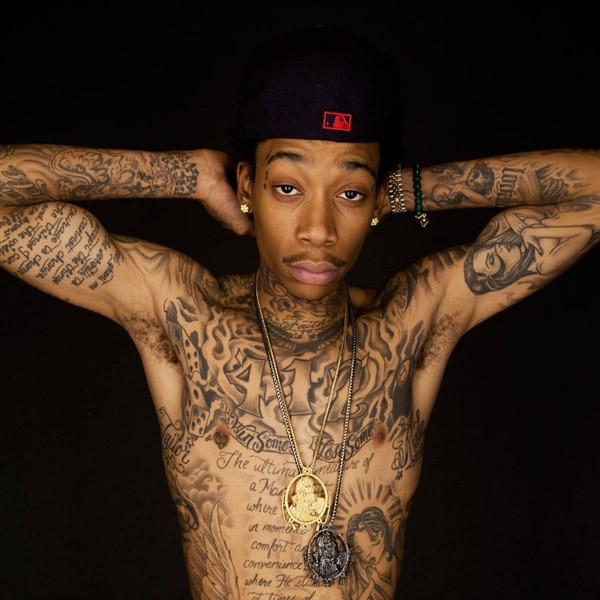 Wiz showing off his tattoos