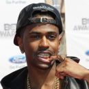 Big Sean showing off his Gold and Silver teeth