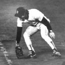In 1986, Bill Buckner allows a ground ball to roll through his legs