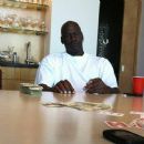 Michael Jordan playing cards with a stack of cash