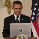 President Barack Obama works on his tech skills