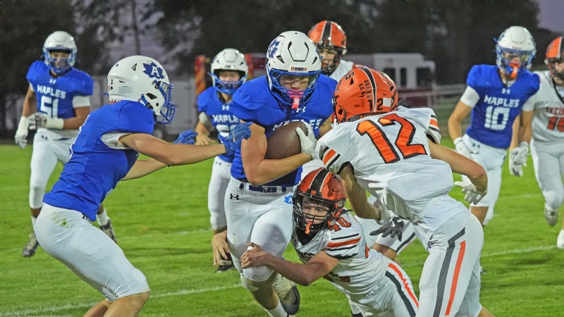 PHOTOS - Adrian welcomes Tecumseh to town for a gridiron battle