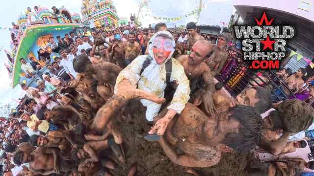 YouTuber Tyler Oliveira Wears A Hazmat Suit To A Festival In India Where Thousands Of People Hurl Po